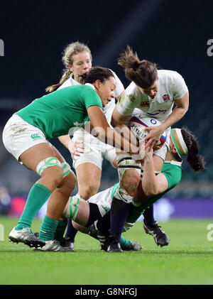 England's Sarah Hunter (right) is challenged by Ireland's Sophie Spence during the 2016 RBS Women's Six Nations match at Twickenham Stadium, London. Stock Photo