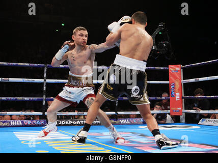 Carl Frampton (left) and Scott Quigg during their IBF & WBA World Super-Bantamweight Championship bout at Manchester Arena. Stock Photo