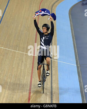 New Zealand's Sam Webster celebrates with the flag Gold in the Men's Team Sprint during day one of the UCI Track Cycling World Championships at Lee Valley VeloPark, London. Stock Photo