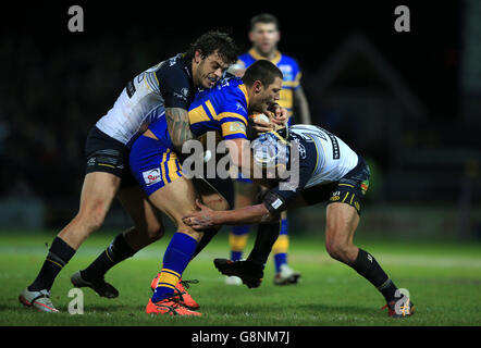 North Queensland Cowboys Ethan Lowe (left) and Johnathan Thurston tackle Leeds Rhinos Ryan Hall during the World Club Series match at Headingley Stadium, Leeds. Stock Photo