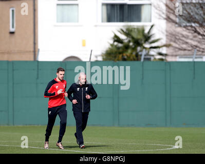 Liverpool's Jordan Henderson during a training session ahead of the Capital One Cup Final, at Melwood Training Ground, Liverpool. Stock Photo