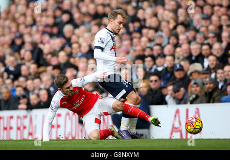 Tottenham Hotspur v Arsenal - Barclays Premier League - White Hart Lane. Arsenal's Aaron Ramsey and Tottenham Hotspur's Christian Eriksen battle for the ball Stock Photo