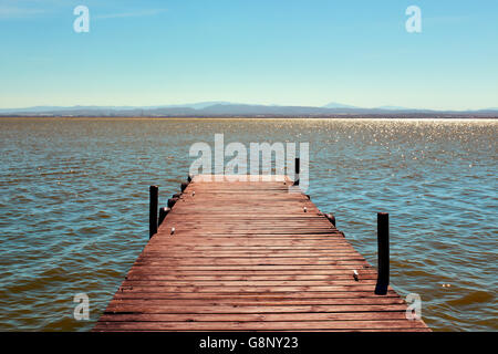 a wooden dock over the lagoon in the Albufera de Valencia, in Valencia, Spain Stock Photo