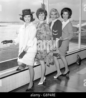 (l-r) Miss Ireland Marlene McKeown, 18, Miss Scotland Gay Taylor, 20, Miss England Susan Pratt, 20 and Miss Wales Maureen Thomas, 19. They were flying from Heathrow Airport to Miami, Florida, to take part in the Miss Universe contest. Stock Photo