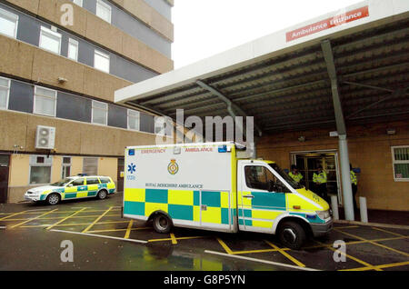 An ambulance parked outside a hospital. Stock Photo