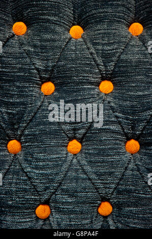 Yellow Fabric Buttons on Grey Material Stock Photo