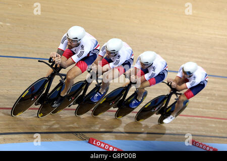 Great Britain's Sir Bradley Wiggins leads the team in the Men's Team Pursuit First Round during day two of the UCI Track Cycling World Championships at Lee Valley VeloPark, London. Stock Photo