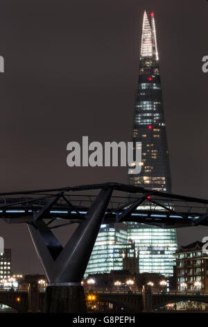 General view of the Shard and Millennium Bridge at low tide along the River Thames
