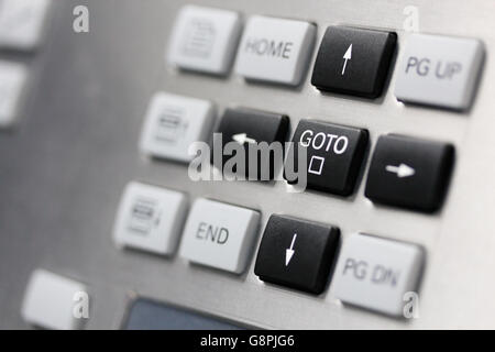 Close up of control panel keypad. Cursor keys buttons. Selective focus on GOTO key. Stock Photo