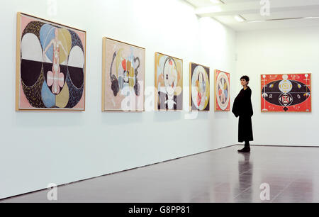 A woman views 'Group IV, no.12 to 16' 1908 by Swedish artist Hilma af Klint during the press preview of 'Hilma af Klint: Painting the Unseen' exhibition at the Serpentine Gallery, London. Stock Photo