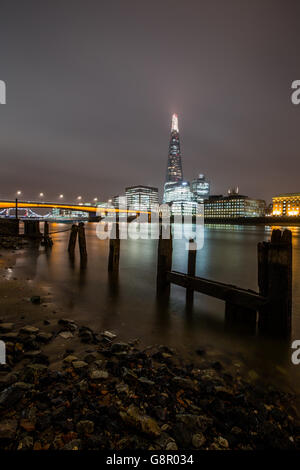 City Views - London. General view of the Shard and London Bridge at low tide along the River Thames Stock Photo