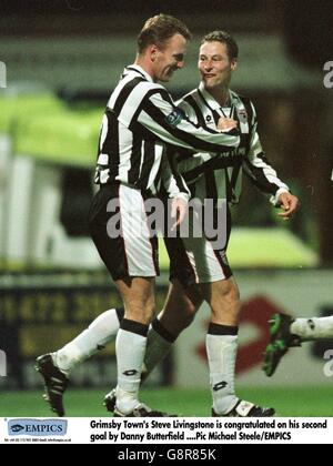 Grimsby Town's Steve Livingstone (left) is congratulated on his second goal by teammate Danny Butterfield (right) Stock Photo