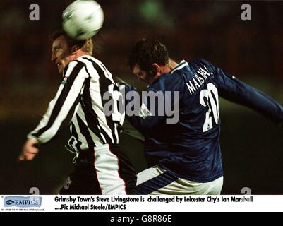 Soccer - Coca Cola Cup - Grimsby Town v Leicester City. Grimsby Town's Steve Livingstone (left) is challenged by Leicester City's Ian Marshall (right) Stock Photo