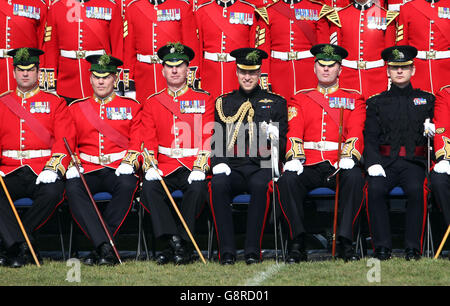 The Duke of Cambridge (third from right) poses for a group photograph with the Irish Guards during a visit to Cavalry Barracks in Hounslow, west London, for the regiment's St Patrick's Day Parade. Stock Photo