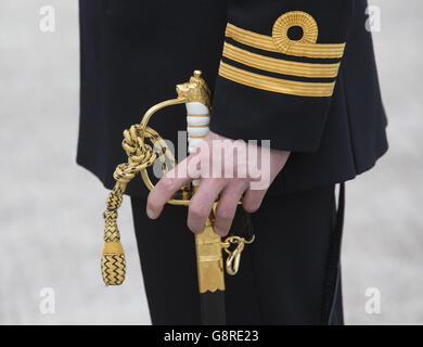 A submariner during a commissioning ceremony at Faslane naval base on the Clyde where the 7,400-tonne nuclear-powered submarine officially joined the Royal Navy fleet. Stock Photo