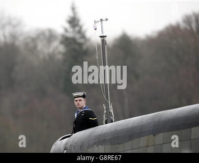 A submariner ahead of a commissioning ceremony at Faslane naval base on the Clyde where the 7,400-tonne nuclear-powered submarine officially joined the Royal Navy fleet. Stock Photo