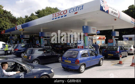 Motorists queue at a petrol station in Cardiff, Tuesday September 13, 2005, as anxious drivers across the country try to fill up ahead of tomorrows proposed fuel protests. A key figure in the nationwide fuel protest which brought Britain to a standstill five years ago called for panic buying motorists to remain calm today. Welsh farmer Brynle Williams was one of the ringleaders who emerged to spearhead the crippling UK-wide fuel duty protests in September 2000, appealed to drivers to stay calm today, claiming there is 'absolutely no need to panic buy'. See PA Story POLITICS Fuel Wales. PRESS Stock Photo