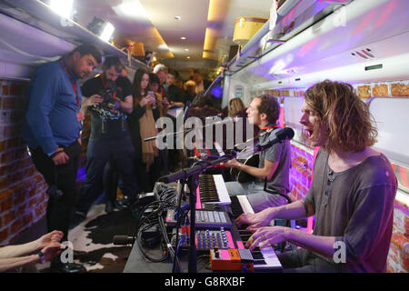 EDITORIAL USE ONLY (Left to right) William Rees and Blaine Harrison from Mystery Jets performs onboard the new Virgin Radio Star train, which will be broadcasting the launch of Virgin Radio live as it travels to London. Stock Photo