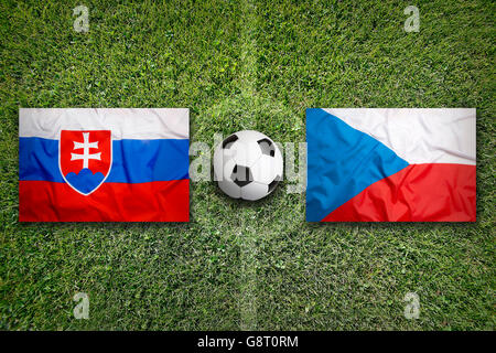 Slovakia vs. Czech Republic flags on green soccer field Stock Photo