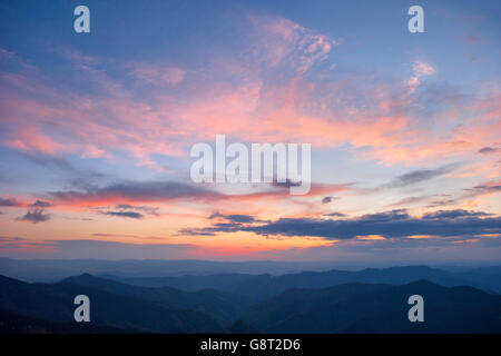 Early spring in the Carpathian Mountains. dramatic red sky in the clouds. Stock Photo