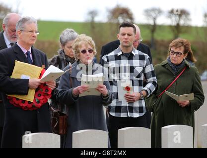 Musician Harry Judd with his father Christopher (left) aunt Selina Cohen (2nd left) and mother Emma (right) attend the rededication ceremony of his great great uncle The Reverend Alan Judd MC at the Fifteen Ravine British Cemetery in Villers-Plouich, France. Stock Photo