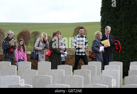 Musician Harry Judd (third from right) arrives with family members for the rededication ceremony of his great great uncle The Reverend Alan Judd MC at the Fifteen Ravine British Cemetery in Villers-Plouich, France. Stock Photo