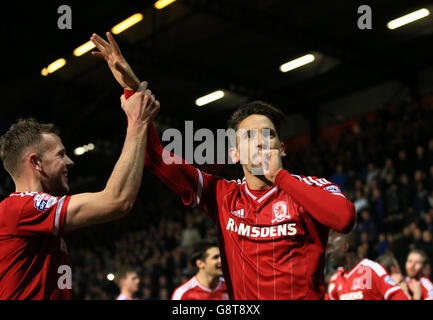 Middlesbrough's Gaston Ramirez (right) celebrates scoring his side's second goal of the game during the Sky Bet Championship match at Loftus Road, London. Stock Photo