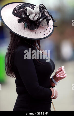 A Female racegoer during Ladies Day of the Crabbie's Grand National Festival at Aintree Racecourse, Liverpool. Stock Photo