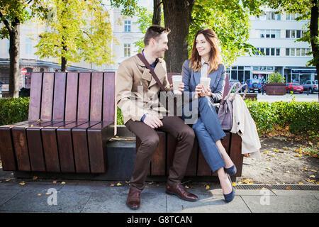 Mid adult couple in park having a cup of coffee Stock Photo