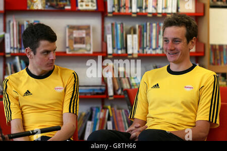 Alistair (right) and Jonny Brownlee during an interview at Bramhope Primary School. Stock Photo