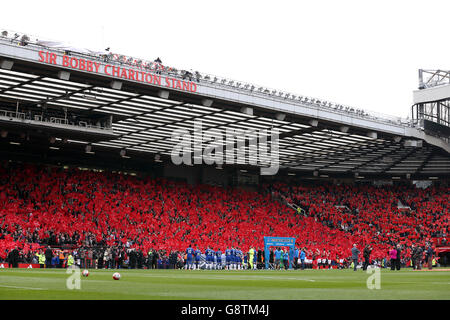 Sir Bobby Charlton (bottom right) looks on as the South Stand is officially renamed the Sir Bobby Charlton Stand, before the Barclays Premier League match at Old Trafford, Manchester. PRESS ASSOCIATION Photo. Picture date: Sunday April 3, 2016. See PA story SOCCER Man Utd. Photo credit should read: Martin Rickett/PA Wire. Stock Photo