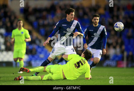 Brighton and Hove Albion's Lewis Dunk (on floor) and Birmingham City's Kyle Lafferty battle for the ball during the Sky Bet Championship match at St Andrews, Birmingham. Stock Photo