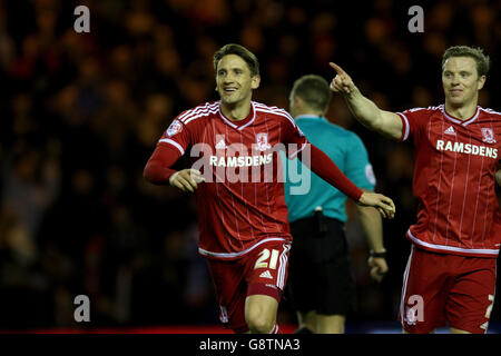 Middlesbrough's Gaston Ramirez (left) celebrates scoring his side's third goal of the game with teammate Grant Leadbitter during the Sky Bet Championship match at the Riverside Stadium, Middlesbrough. Stock Photo