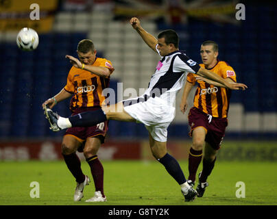 West Bromwich Albion's Neil Clement (C) clears ball away from Bradford City's Dean Windass (L) and Steven Schumacher during the Carling Cup second round match at the Hawthorns, West Bromwich, Tuesday September 20, 2005. PRESS ASSOCIATION Photo. Photo credit should read: Nick Potts/PA. Stock Photo