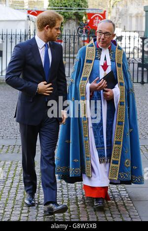 Prince Harry (left) with John Hall, Dean of Westminster Abbey, London, prior to a service of commemoration at the abbey for the victims of the 2015 terrorist attacks in Tunisia. Stock Photo