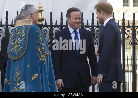 (left to right) Dean Of Westminster John Hall talks with Prime Minister David Cameron and Prince Harry prior to a service of commemoration at Westminster Abbey, London, for the victims of the 2015 terrorist attacks in Tunisia. Stock Photo