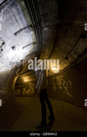 Lead guide Siddy Holloway in an underground tunnel at Down Street ...