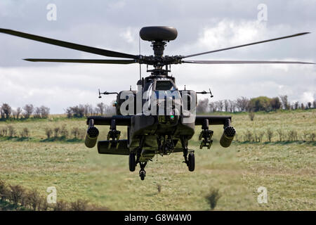 A British Army Air Corps AgustaWestland Apache AH1 Attack Helicopter flying over the Salisbury Plain Military Training Area,UK. Stock Photo
