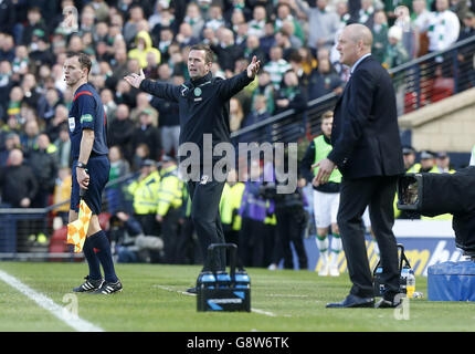 Rangers' manager Mark Warburton (right) and Celtic manager Ronny Deila during the William Hill Scottish Cup semi-final match at Hampden Park, Glasgow. Stock Photo