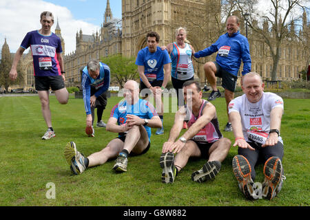 Members of Parliament (from left) Dan Jarvis, Jamie Reed, Alistair Burt, Edward Timpson, Amanda Solloway, Alun Cairns, Simon Danczuk and Graham Evans, outside the Houses of Parliament in central London as they prepare to run in this year's Virgin Money London Marathon. Stock Photo