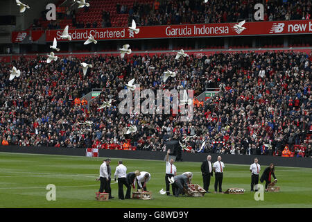 Doves are released from the pitch during the Hillsborough 27th Anniversary Memorial Service at Anfield, Liverpool. PRESS ASSOCIATION Photo. Picture date: Friday April 15, 2016. See PA story SOCCER Hillsborough. Photo credit should read: Peter Byrne/PA Wire. Stock Photo