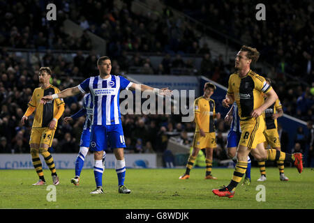 Brighton and Hove Albion's Tomer Hemed (left) celebrates scoring his side's first goal of the game from the penalty spot during the Sky Bet Championship match at the AMEX Stadium, Brighton. Stock Photo