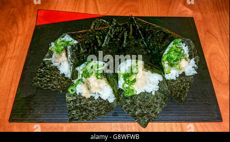 Star of the dinner at Sushi Hachi in Richmond, BC, Canada ... salmon skin hand roll with tuna belly and green onions. Stock Photo