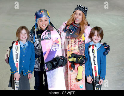 Stacey Solomon (centre right), who took part in The Jump, and British Olympic snowboarder, Aimee Fuller (centre left), launch the inaugural National Schools Snowsport Week, with pupils from the Larmenier and Sacred Heart Catholic Primary School, at The Snow Centre in Hemel Hempstead, Hertfordshire. Stock Photo