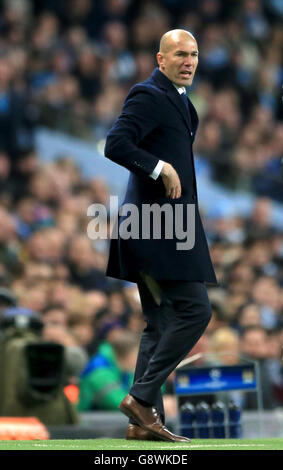 Real Madrid Manager Zinedine Zidane with ripped trousers during the UEFA Champions League, Semi-Final match at the Etihad Stadium, Manchester. Stock Photo