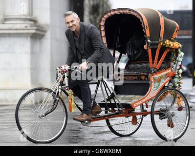 Gary Lineker on a rickshaw as he brings Thailand, Morocco, India and New York to Marble Arch, London, for the launch of Walkers Spell & Go campaign, where people collect letters in packs of crisps to be in with a chance of winning one of 20,000 holidays up for grabs. Stock Photo