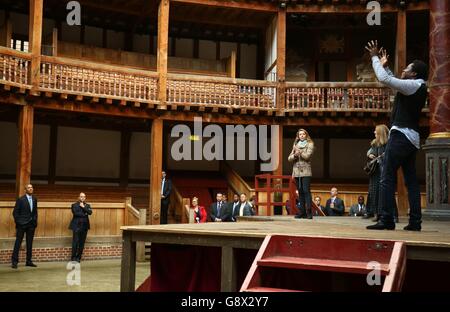 US President Barack Obama watches a performance during a visit to the Globe Theatre in London to mark the 400th anniversary of the death of William Shakespeare. Stock Photo