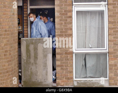 Forensic teams outside the flat on the Milford Towers estate in Catford, south London, Friday September 30, 2005, where the body of Rochelle Holness was found on Wednesday morning. A man and woman were today being questioned about the murder of the 15-year-old girl whose dismembered body was found inside binliners and dumped on open ground on the estate. Rochelle, who was from Lewisham, south London, had gone out to use a telephone box near the estate on Sunday night and was later reported missing. See PA story POLICE Girl. PRESS ASSOCIATION photo. Photo credit should read: Fiona Hanson/PA.