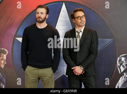 Chris Evans and Robert Downey Jr. (right) attending the Captain America Civil War Photocall, at the Corinthia Hotel, London. PRESS ASSOCIATION Photo. Picture date: Monday April 25, 2016. Photo credit should read: Daniel Leal-Olivas/PA Wire Stock Photo