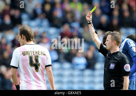 Huddersfield Town v Birmingham City - Sky Bet Championship - The John Smith's Stadium. Match referee David Webb books Huddersfield Town's Dean Whitehead Stock Photo